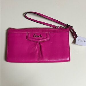 NWT Coach Fuchsia leather wristlet.